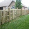 Stepped scalloped wood fence