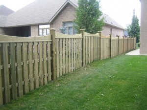 Stepped scalloped wood fence