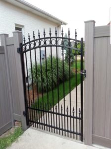 vinyl fence with iron gate