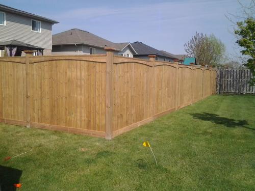 Scalloped wood fence