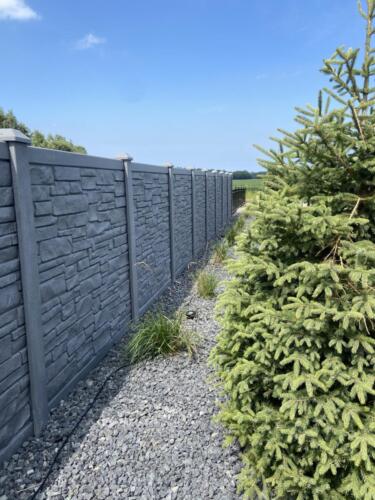 Simulated stone vinyl fence