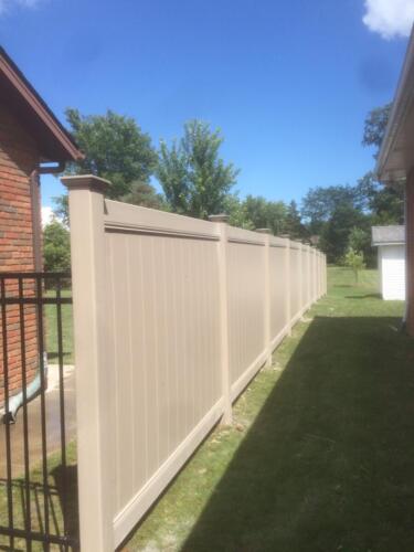 Small iron fence with clay vinyl fence