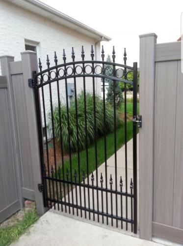 Bufftech Weathered blend vinyl fence with custom iron gate