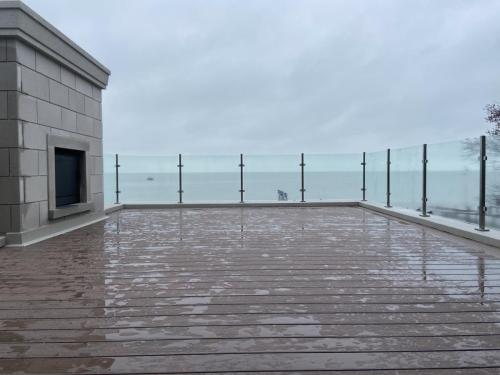 rooftop composite deck with glass railings